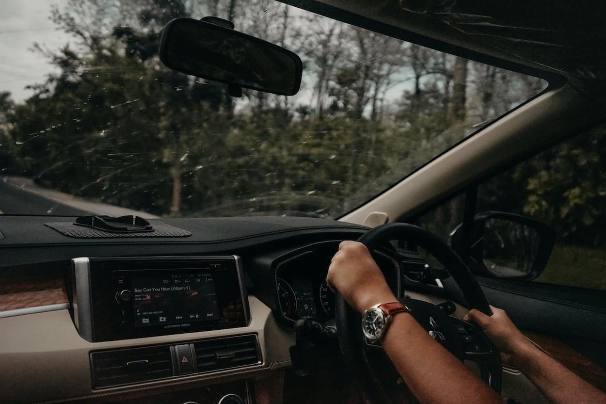 driver learner drive next to her driving instructor